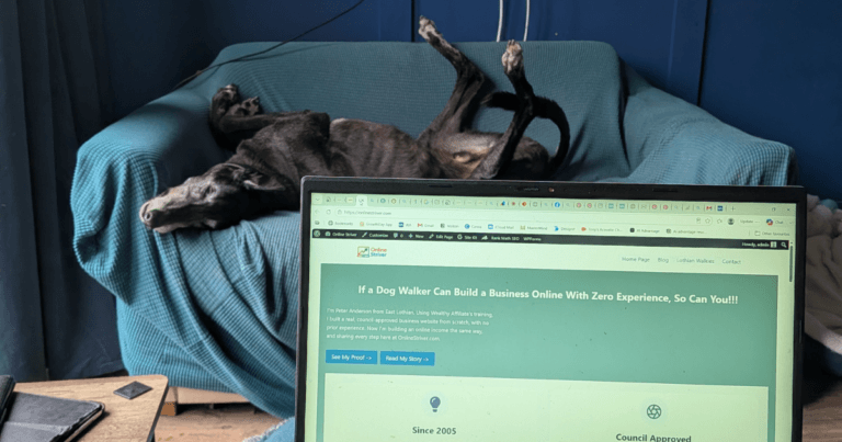 Laptop and notebook showing the real cost to start an online business